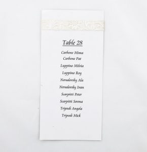 WEDINV30 White table menu guest seating with embossed paper