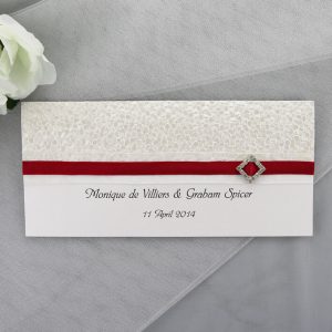 WEDINV145 White Card with White Pebbles Paper Red Ribbon and Diamond Diamante