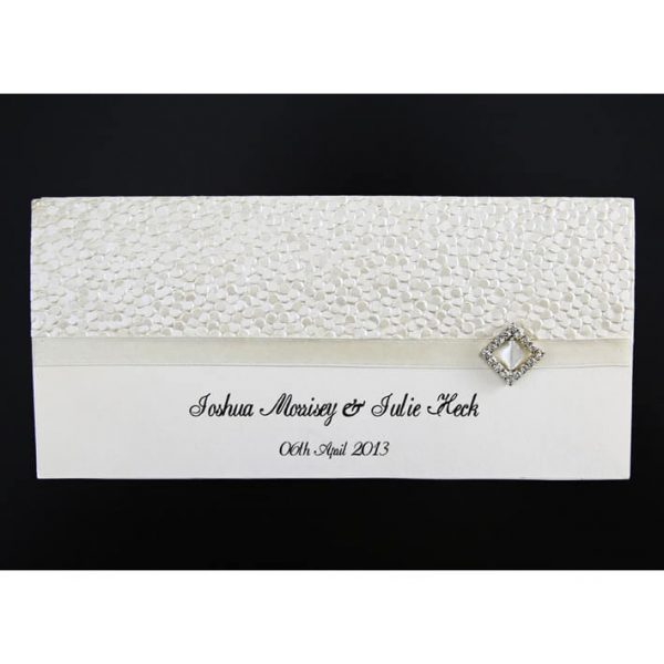 WEDINV11 front of cream wedding invitation with pebbles embossed paper ribbon and diamond diamante