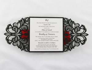 WEDINV130 Inside of black lasercut invitation with red ribbon and white insert