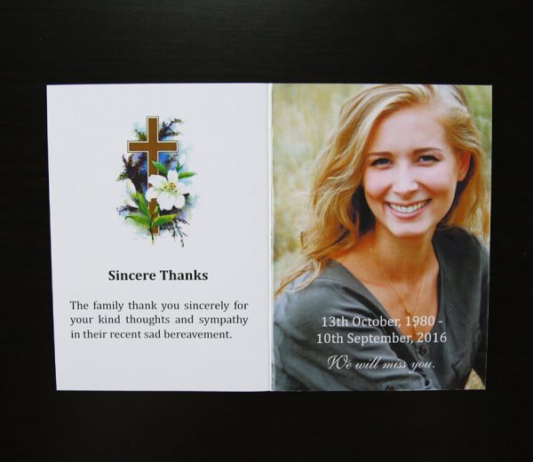 front of religious christian memorial funeral card with roses