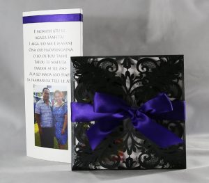 Black laser cut invitation with purple ribbon and white insert white and purple photo tri fold table menus