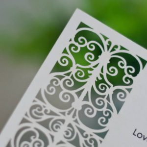 LASINV07 Swirls Close up Ivory lasercut wedding invitation