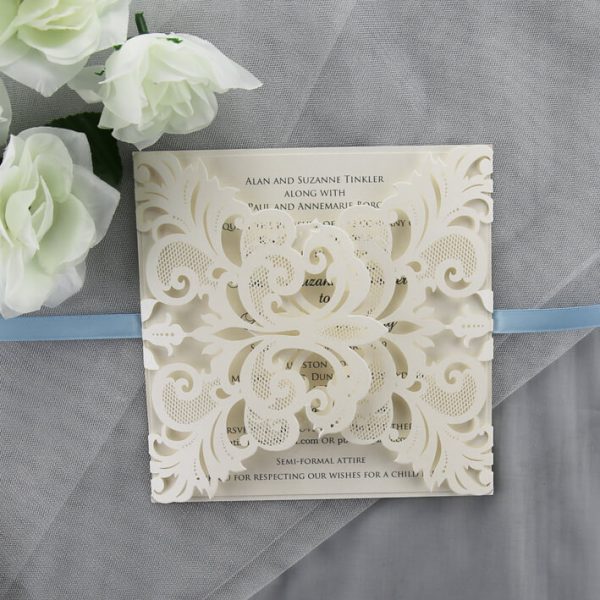 WEDINV188 front of ivory lasercut invitation with baby blue bow and printed in grey