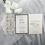 WEDINV193 inside of Ivory and black lasercut invitation with diamante and pocket