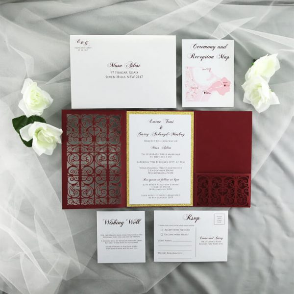 WEDINV198 inside of burgundy lasercut invitation with gold glitter and pocket