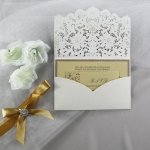WEDINV201 inside of Ivory pocketfold lasercut wedding invitation with gold ribbon and gold glitter